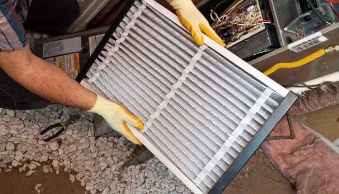 Technician Changing Filter Technician Changing Filter