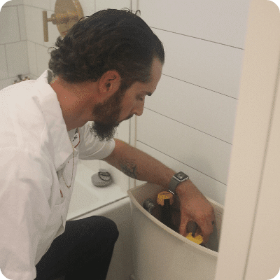 Technician Working On Toilet